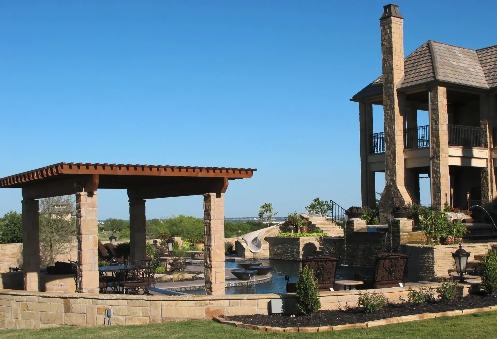 A large house with a pergola in front of it