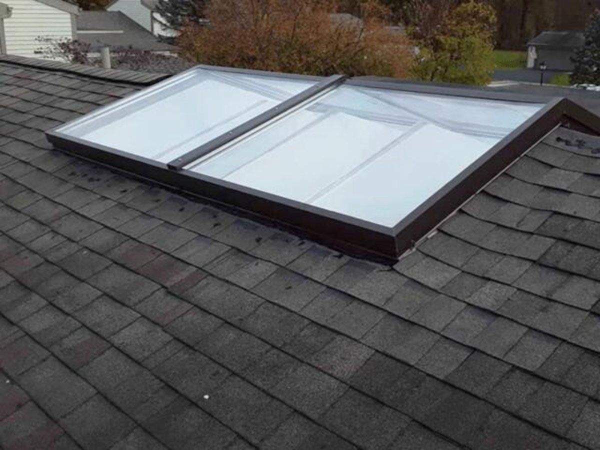 Skylights on a dark shingled roof