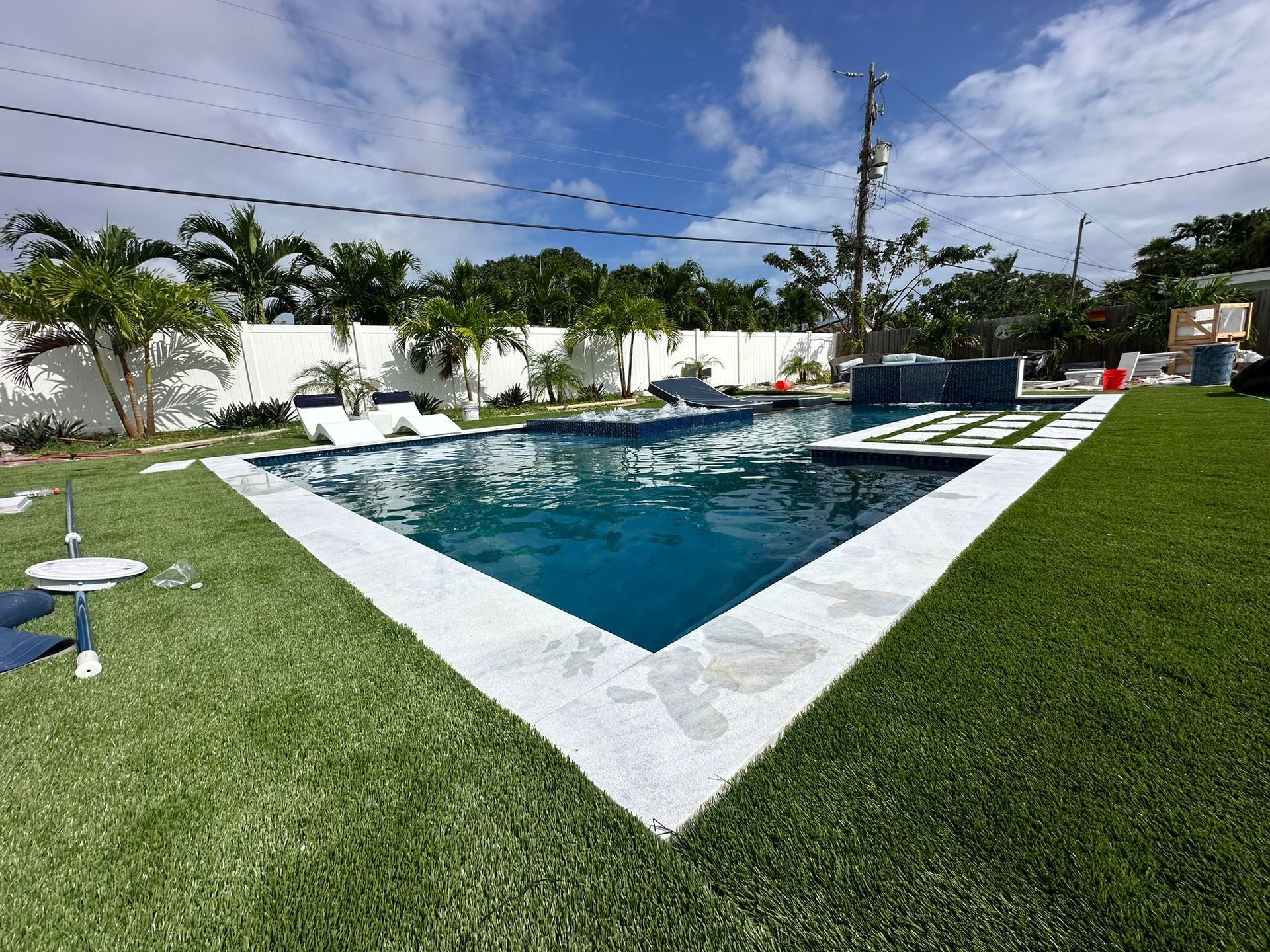 A large swimming pool in the backyard of a house