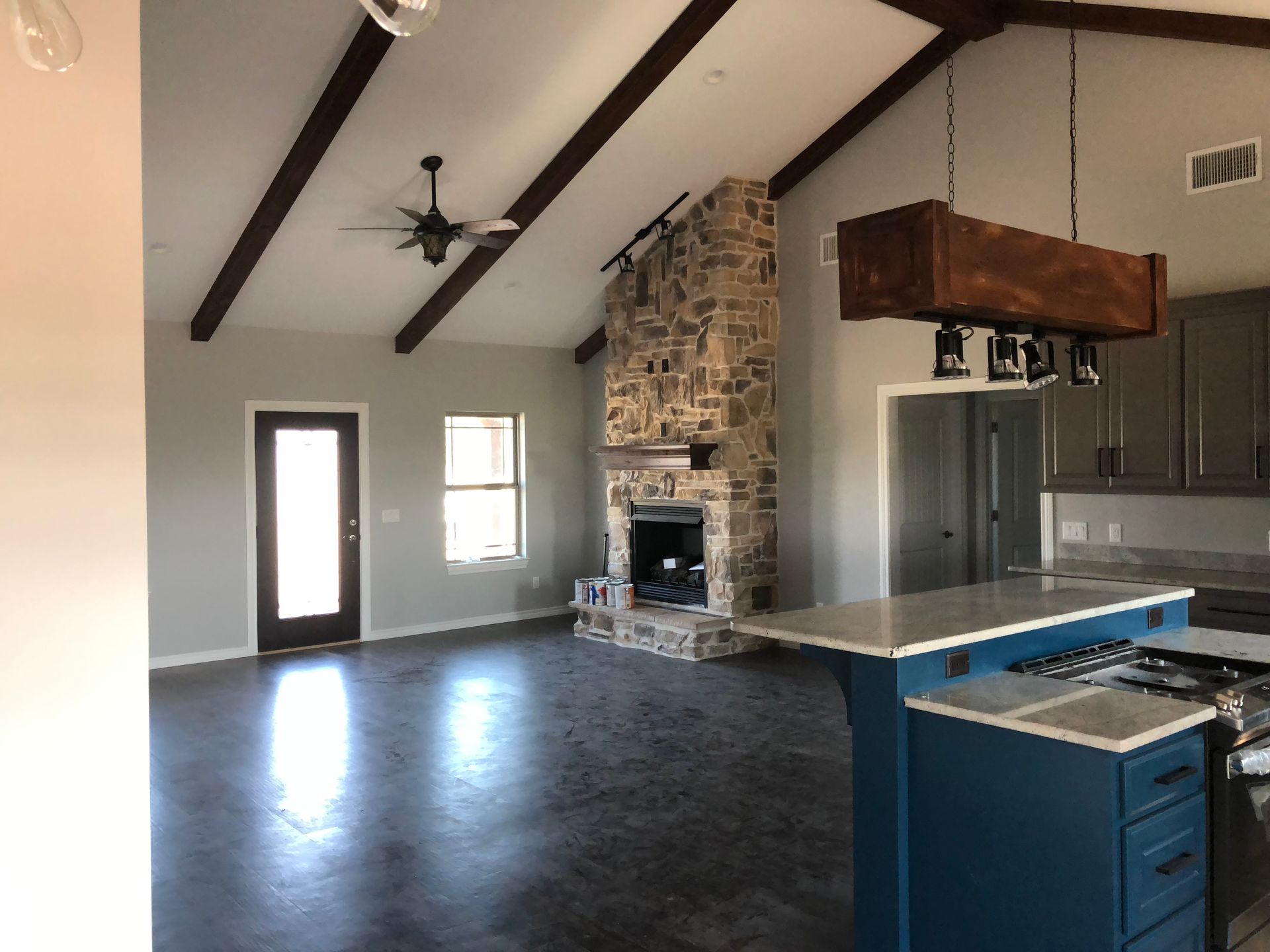 There is a fireplace in the middle of the living room.