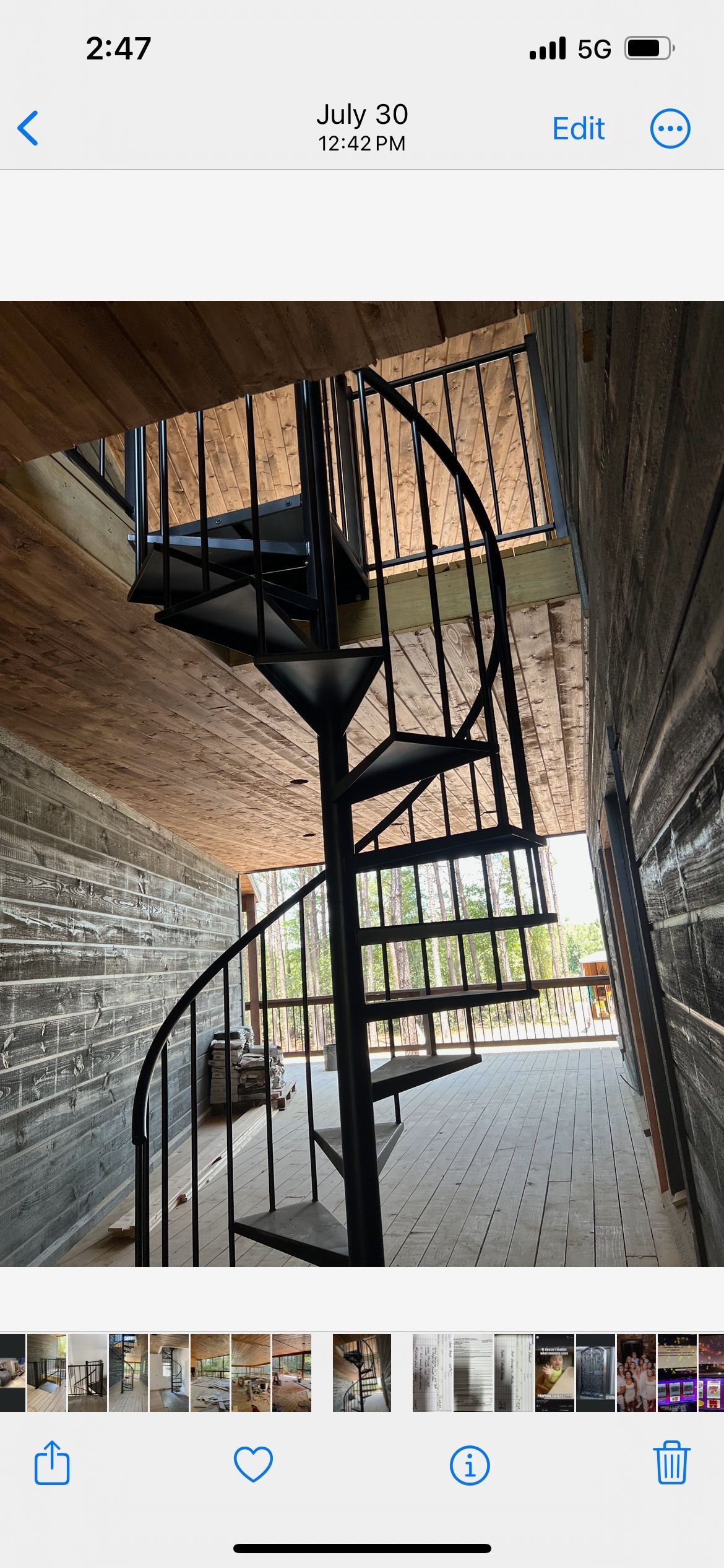 A picture of a spiral staircase on a cell phone.