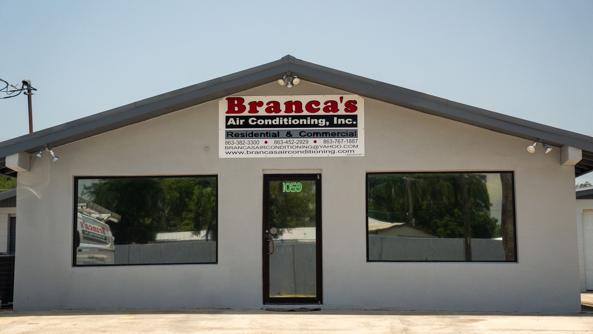 Small beige storefront with a Branca’s Air Conditioning, Inc. sign above the entrance.