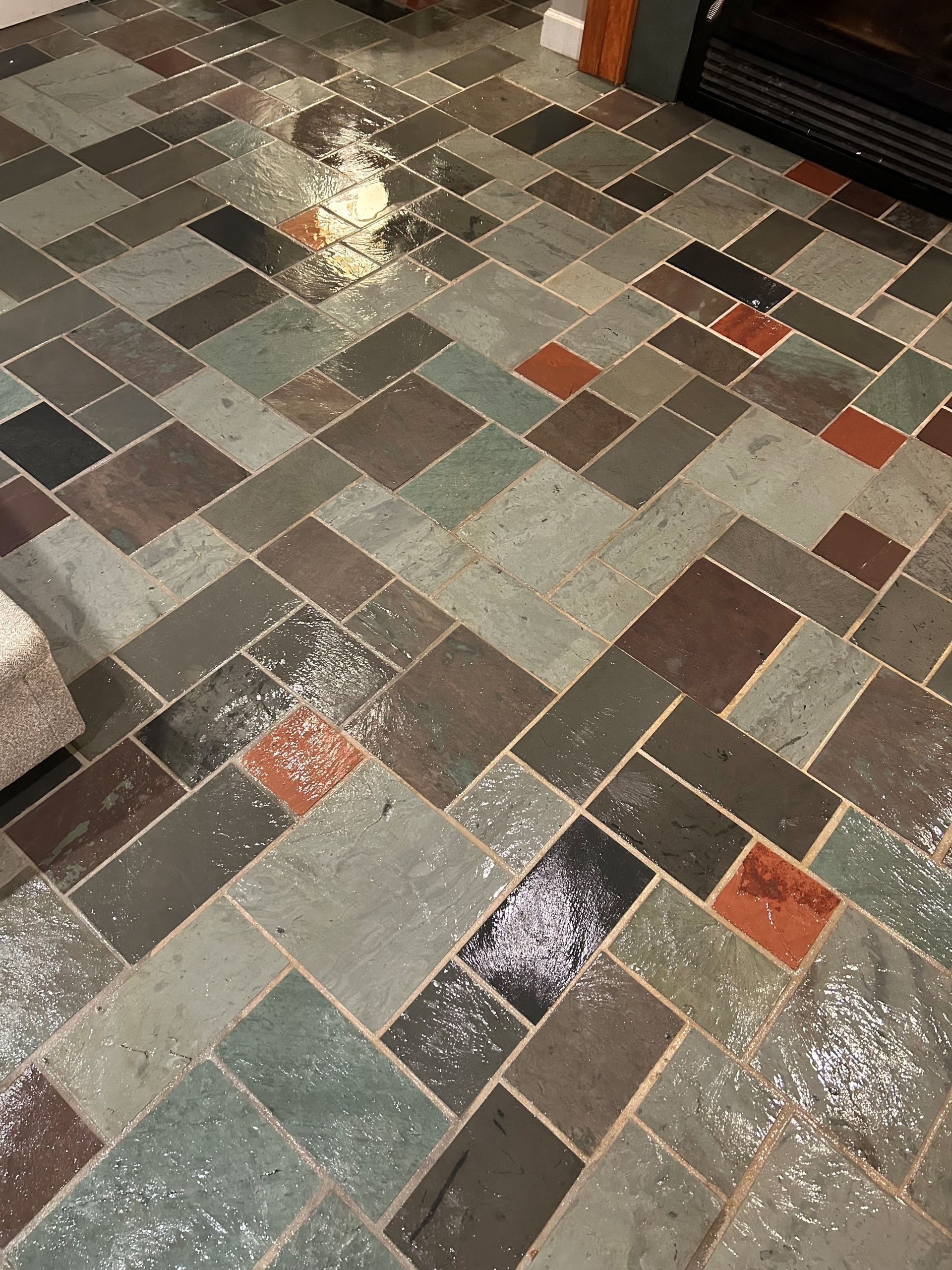 A tiled floor with a lot of different colored tiles.