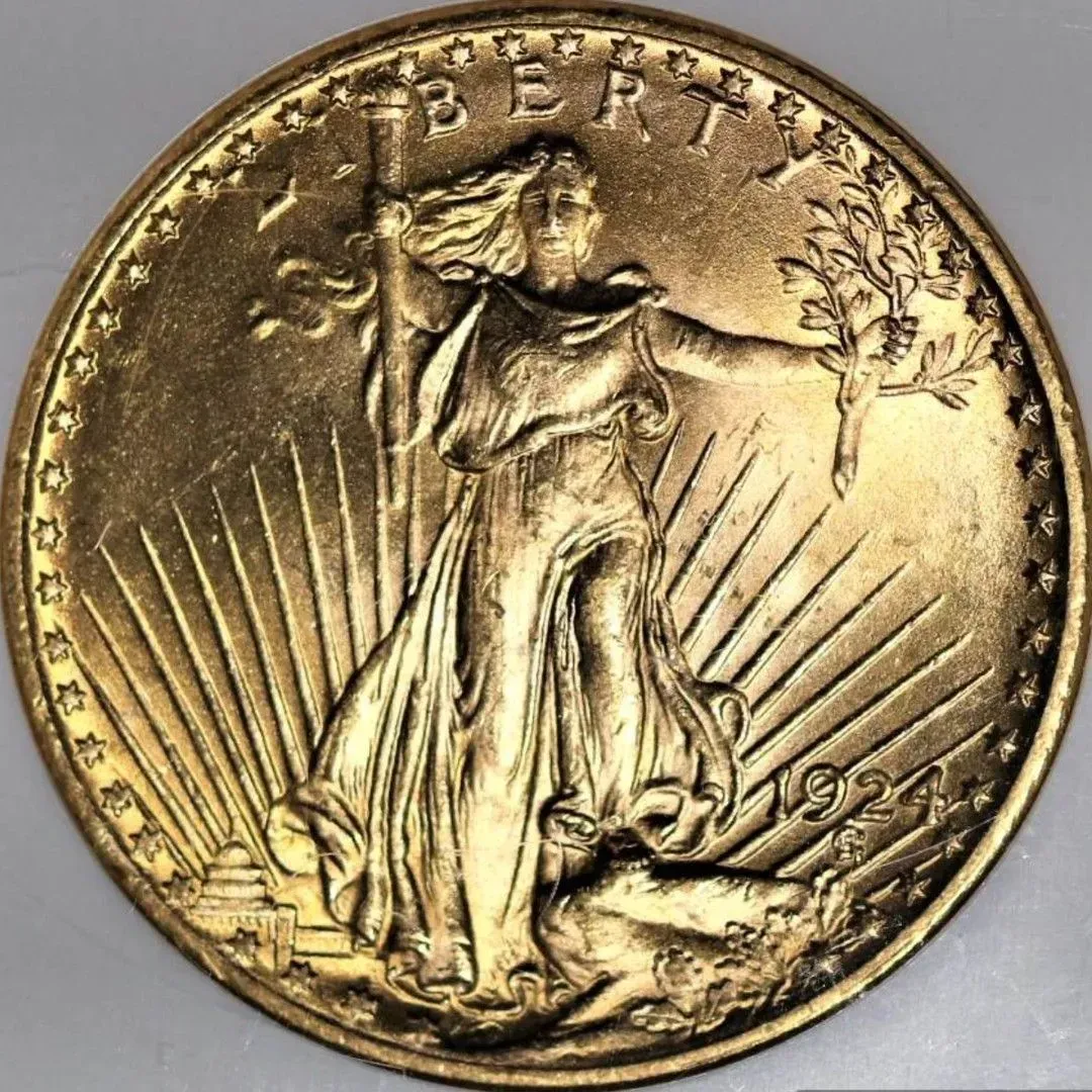 Gold coin with a standing Liberty figure, rays behind her, and the word “LIBERTY” around the rim.