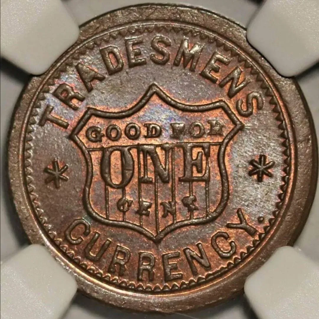 Close-up of a copper token reading “Tribesmen’s Currency” and “Good for One” with star symbols.