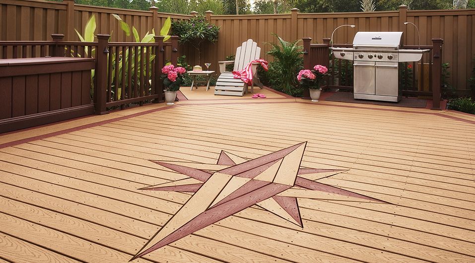 A deck with a compass on it and a grill