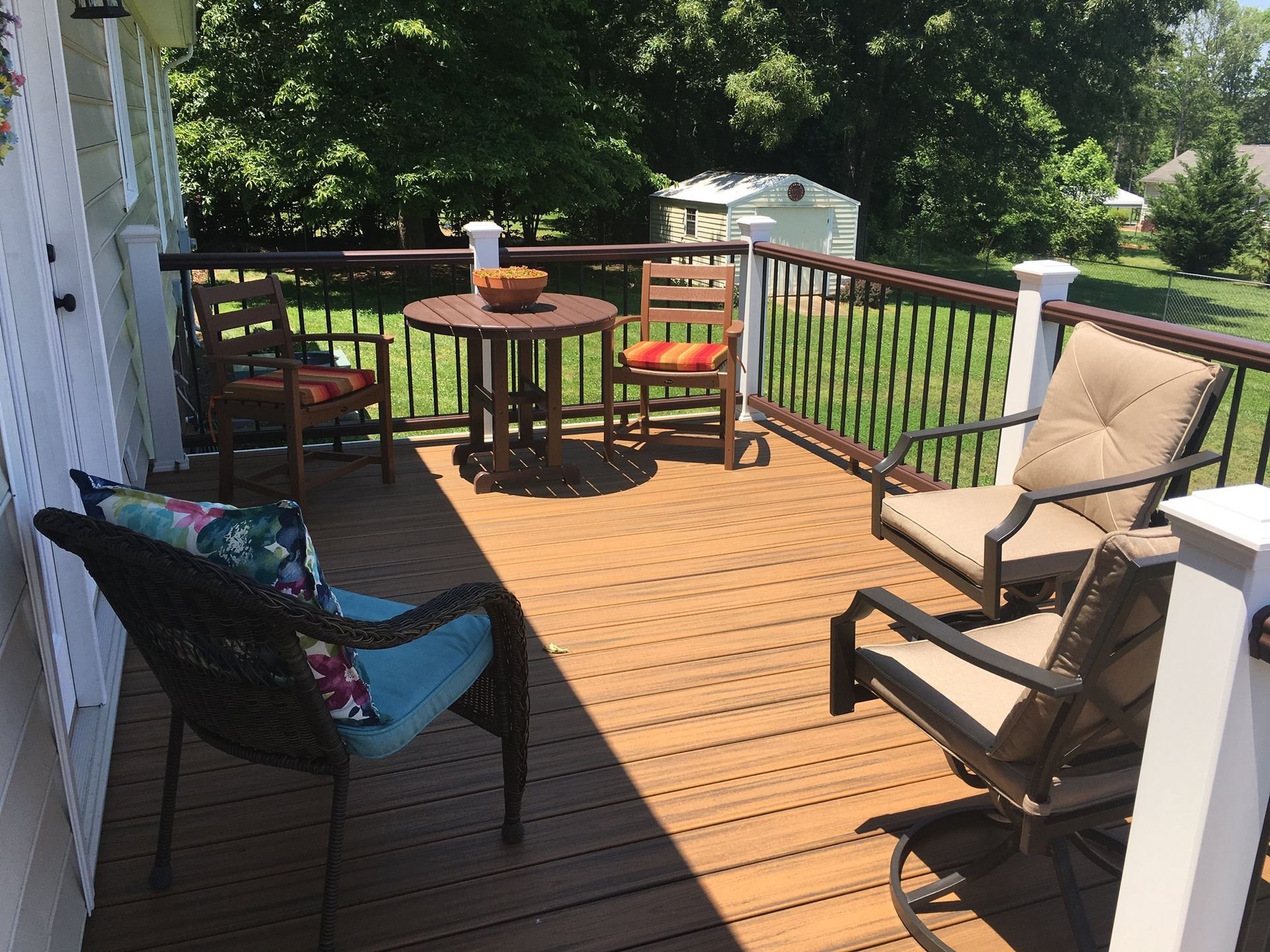 A deck with a table and chairs on it