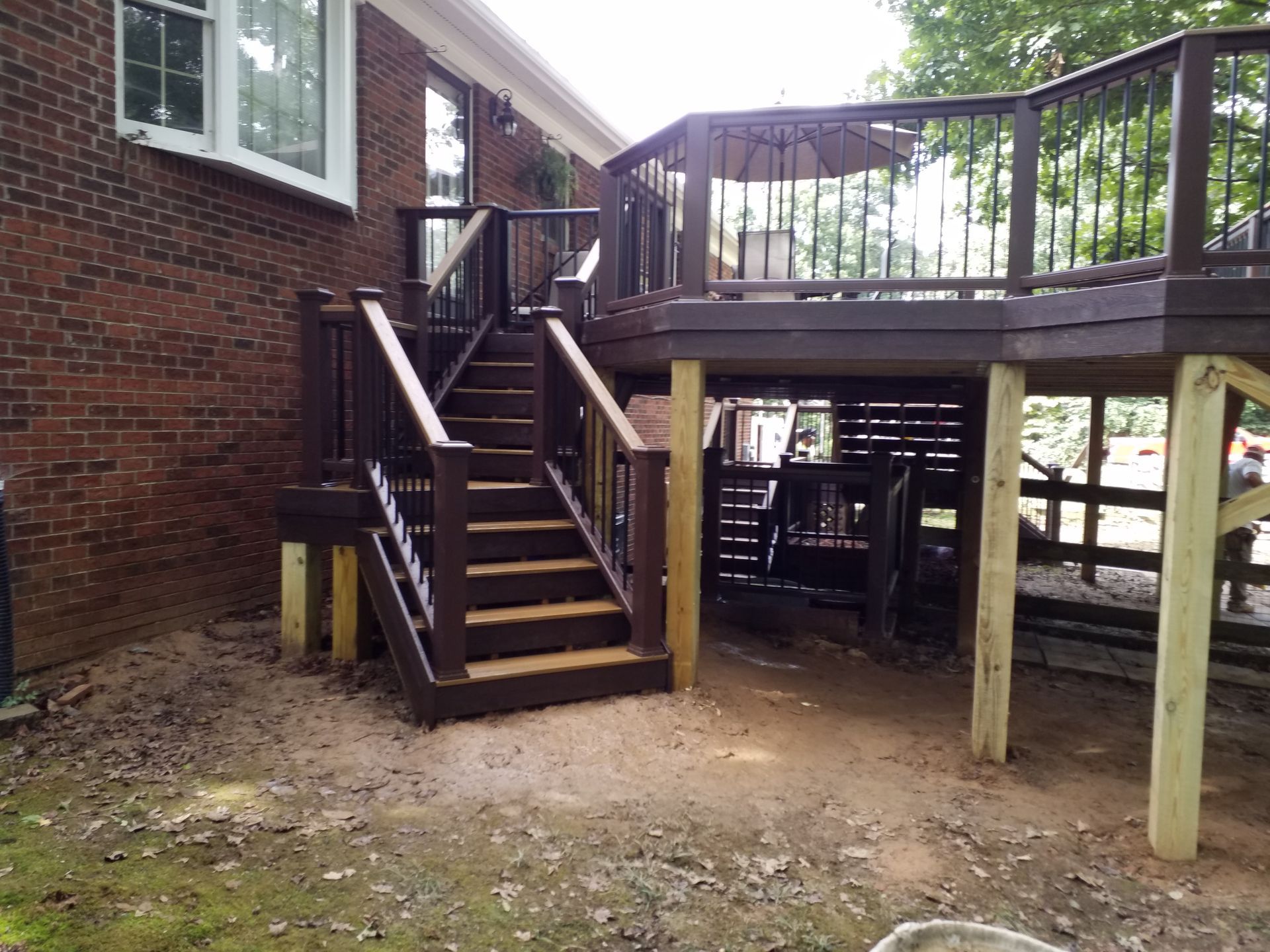 A wooden deck with stairs leading up to it