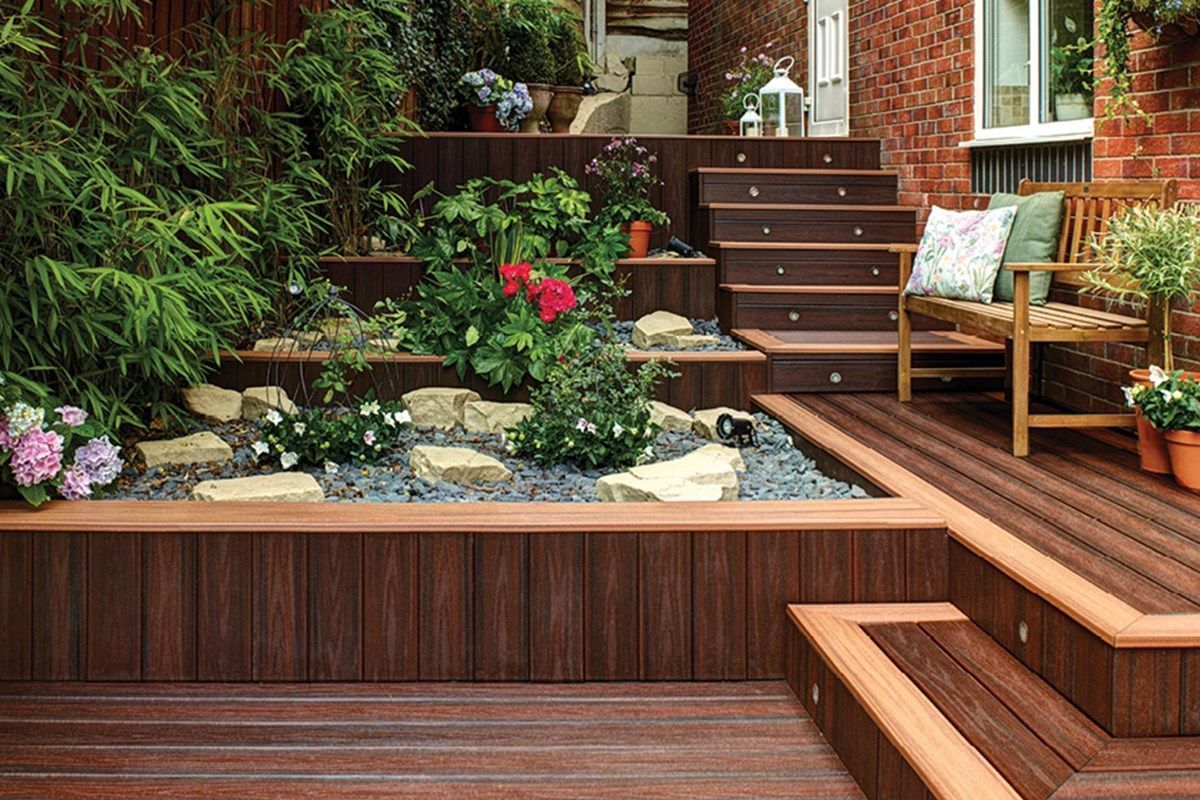 A wooden deck with stairs leading up to it