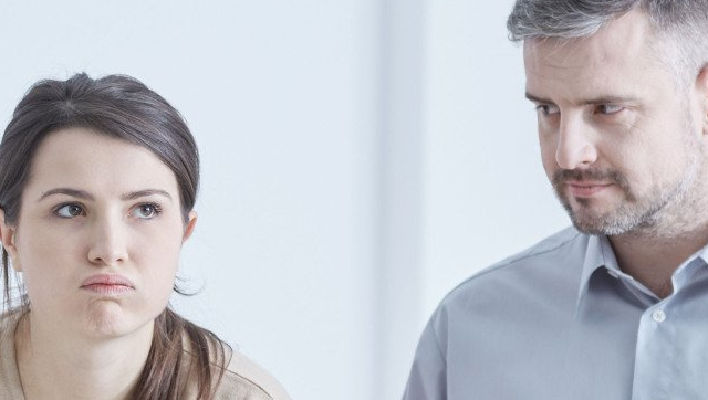 A man and a woman are standing next to each other