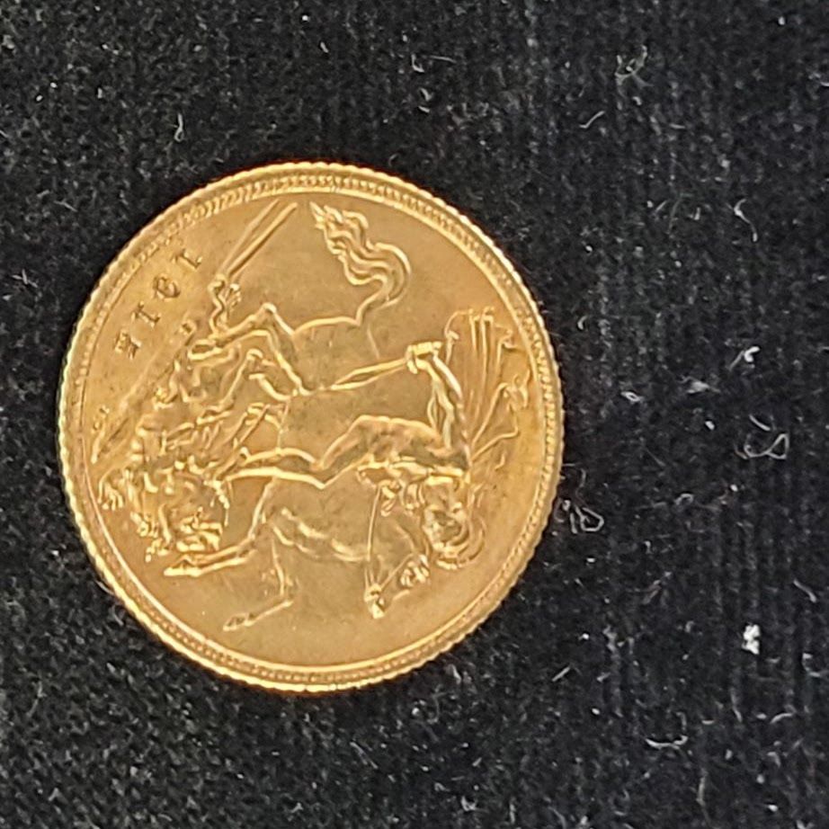 Gold coin, showing a rider slaying a dragon, with the year 1914.