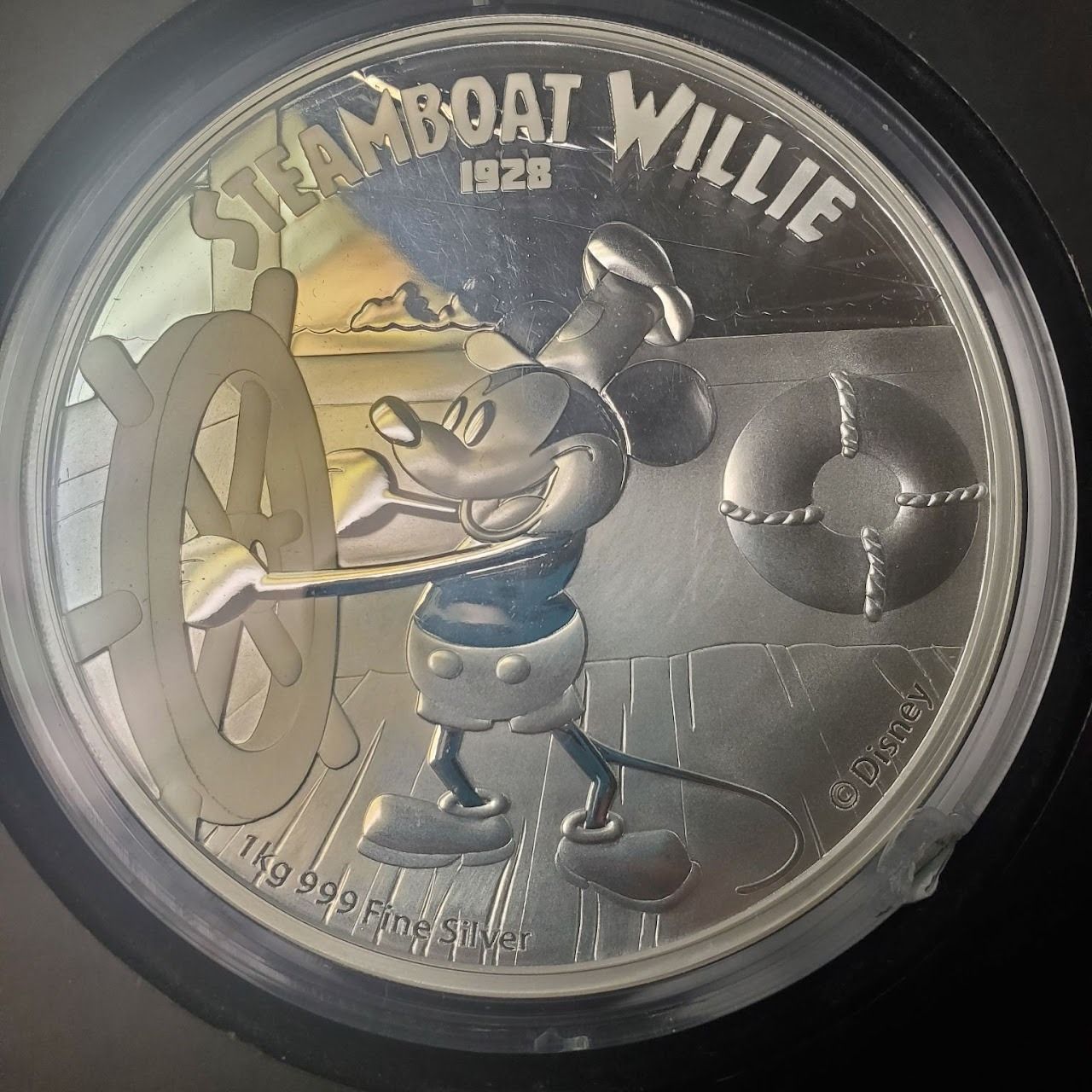 Silver coin with Mickey Mouse from 