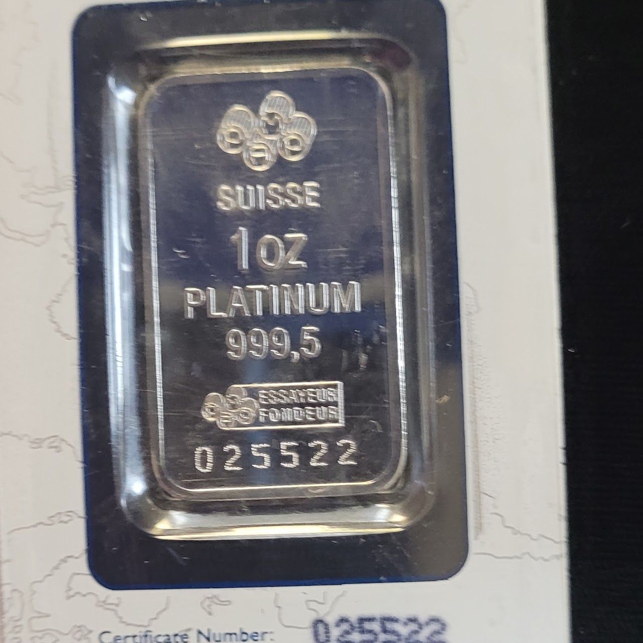 Platinum bar sealed in a blister pack. Marked 