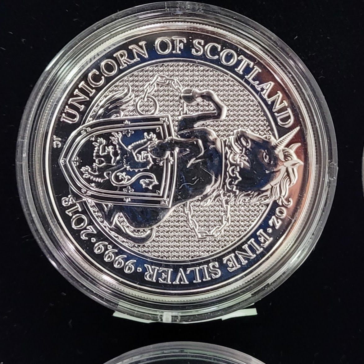 Silver coin, The Unicorn of Scotland, with the unicorn and shield on it.