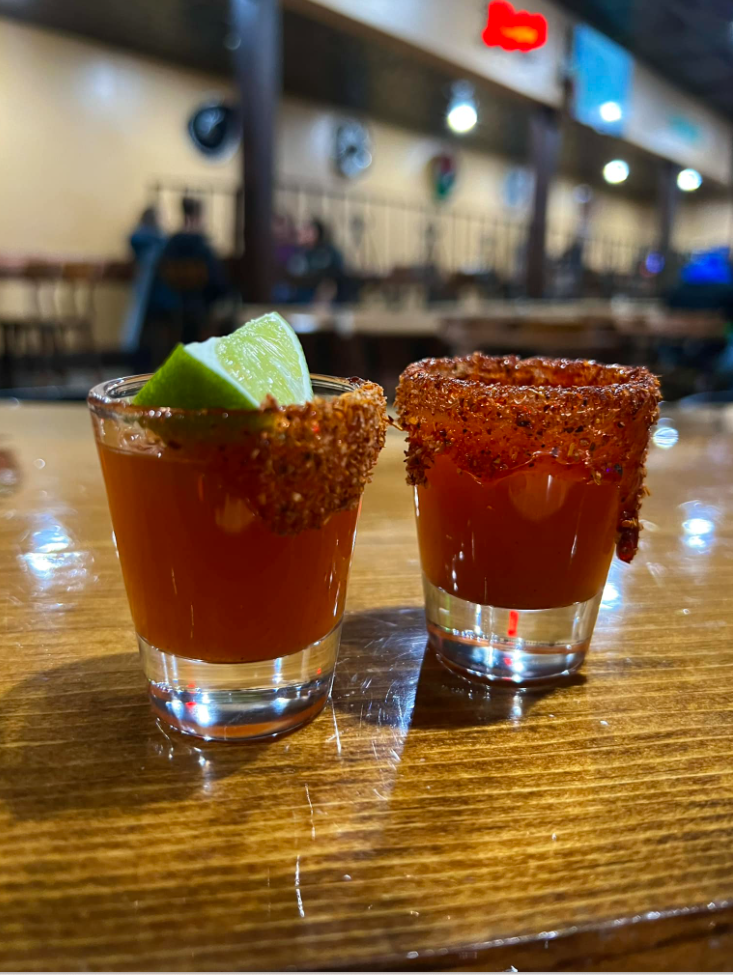 Two shot glasses with red liquid