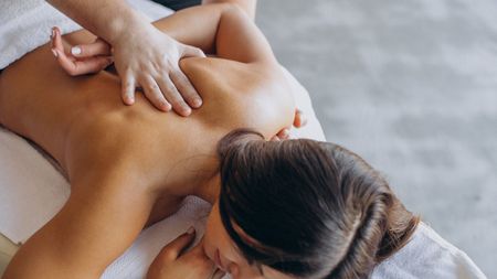 A woman getting a back massage