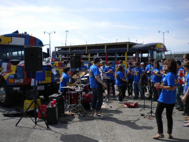 Band playing by the party bus