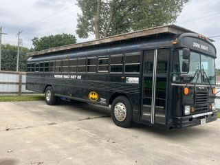 Dark knight party bus side profile