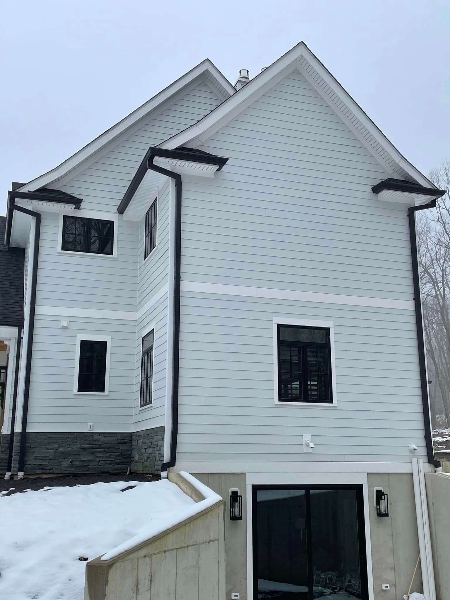 professional installation of black gutter