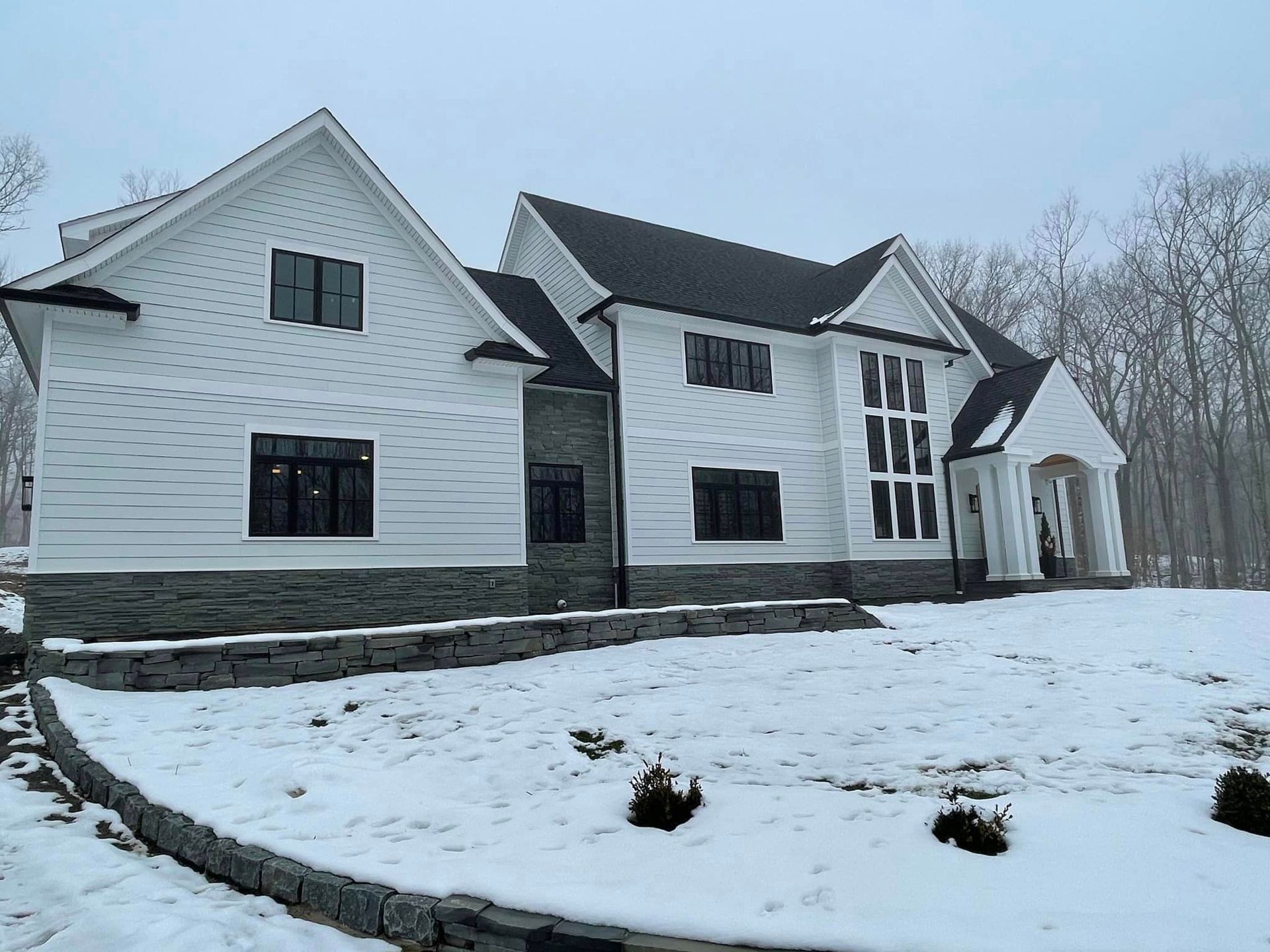 white house with a black gutter