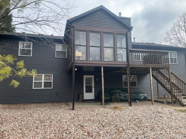 A large house with a lot of windows and stairs