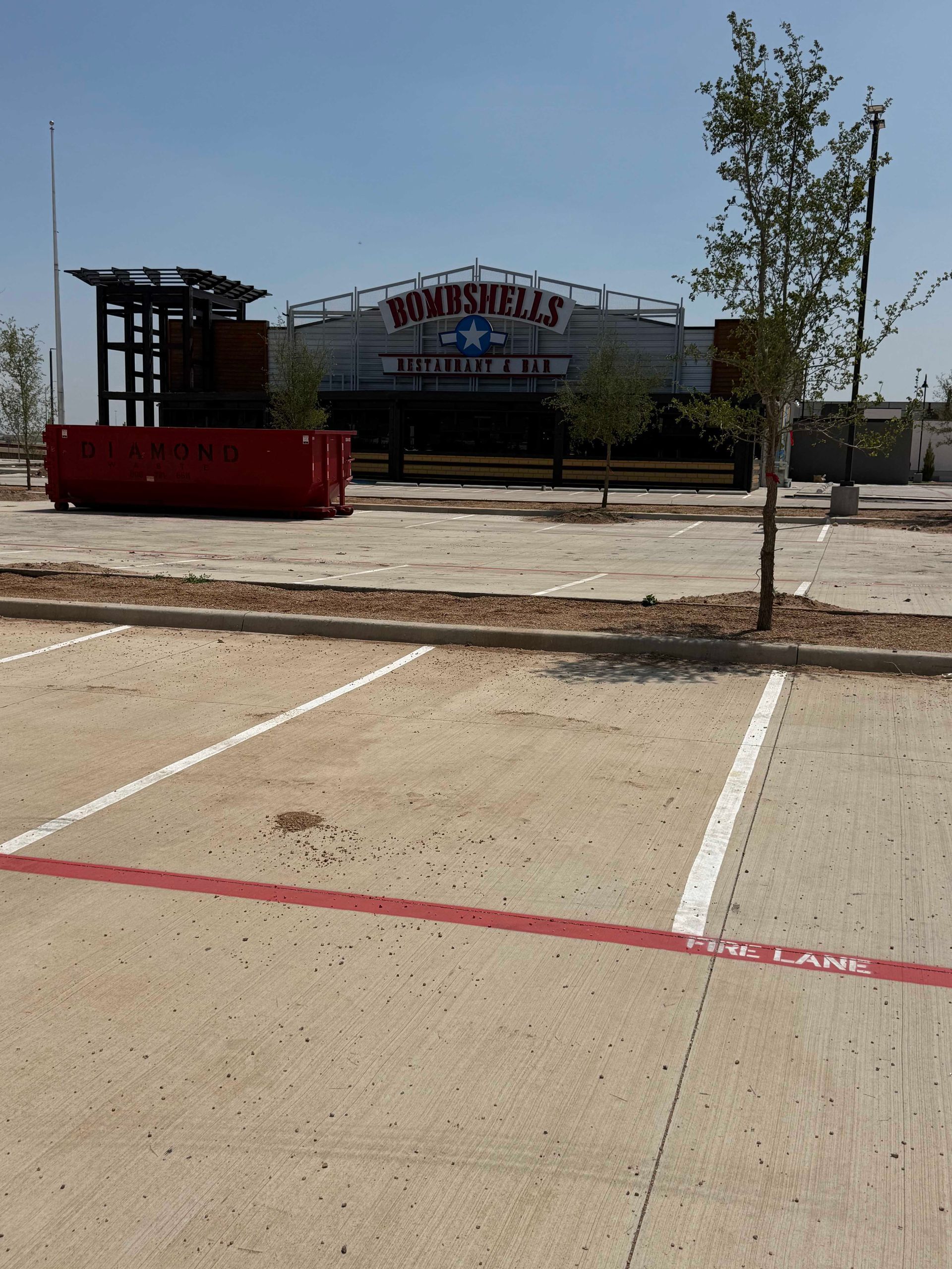 A parking lot in front of a building that says steakhouse