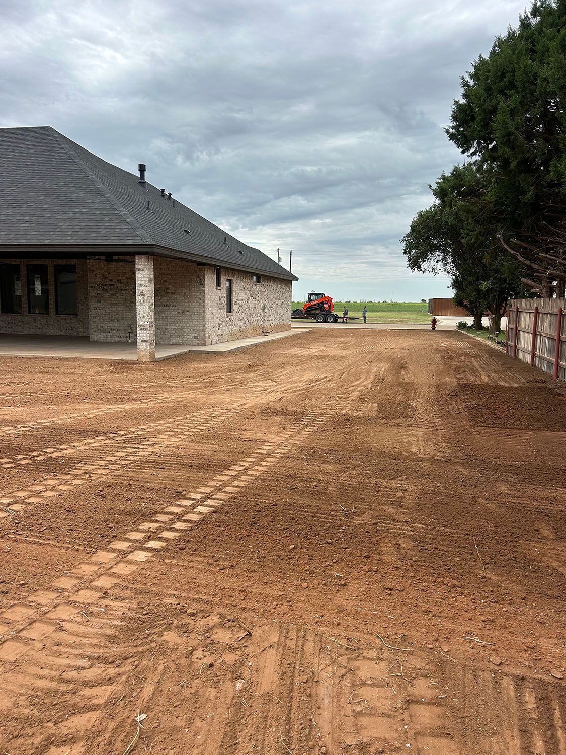 A residential yard that has been recently leveled and cleaned.