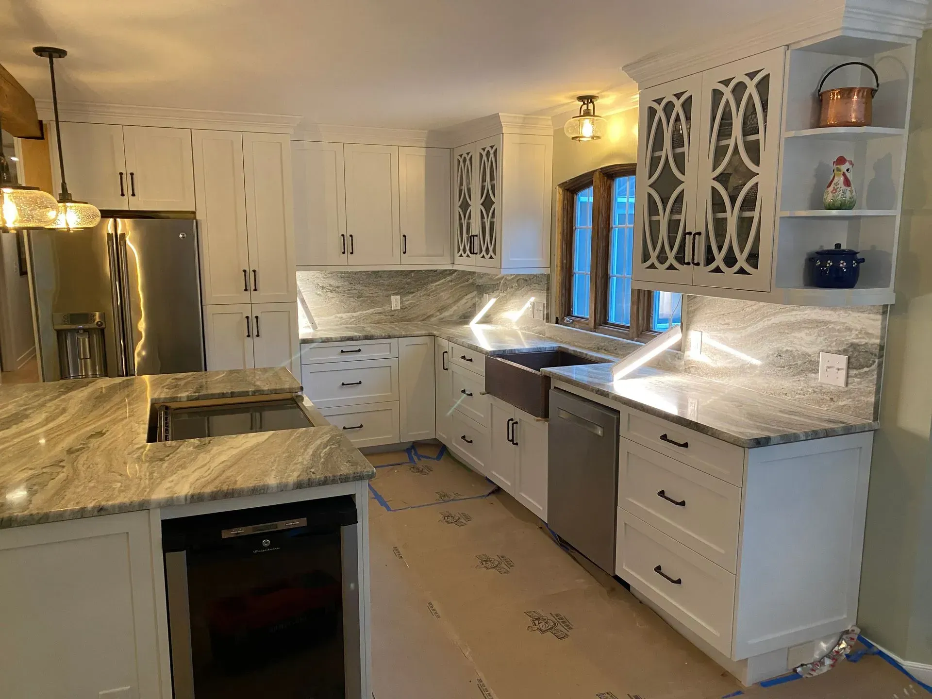 Newly remodeled kitchen with white cabinets, granite countertops, and stainless steel appliances.
