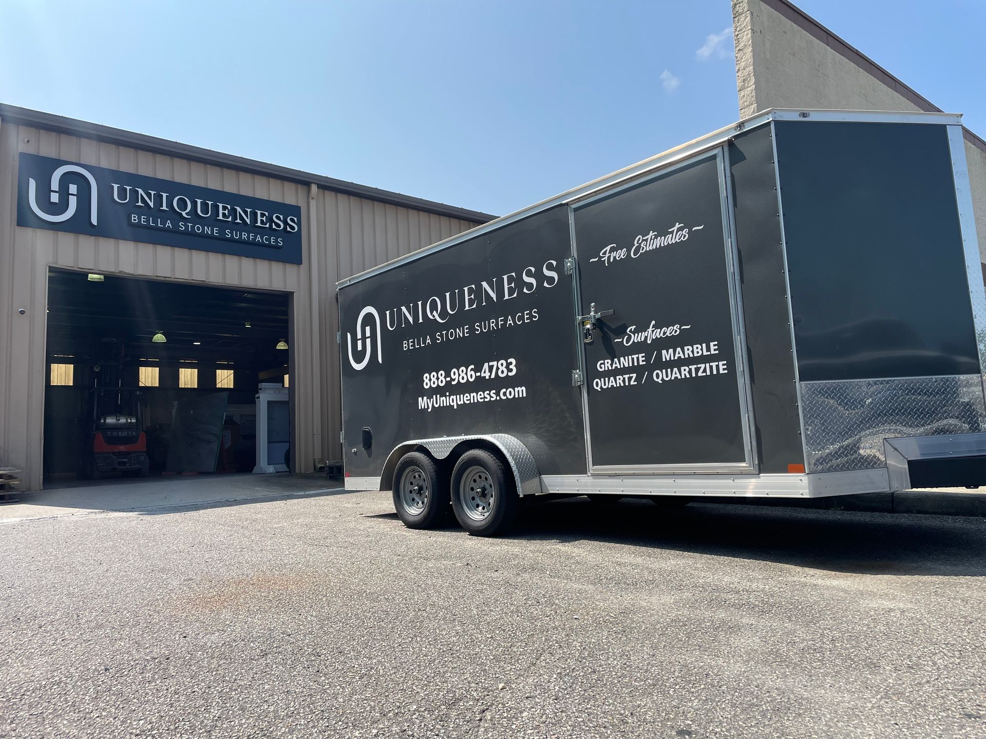 Black trailer and building with 