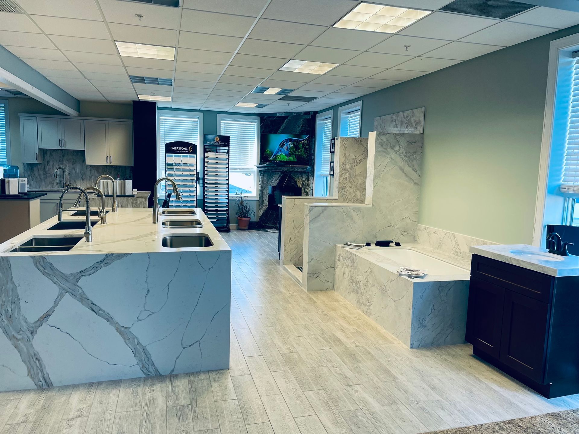 Interior showroom with stone countertops, sinks, and displays.