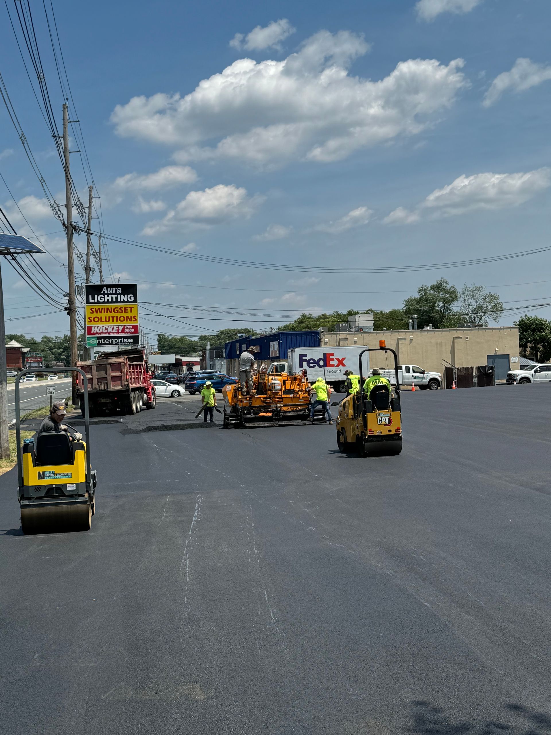A fedex truck is parked on the side of the road