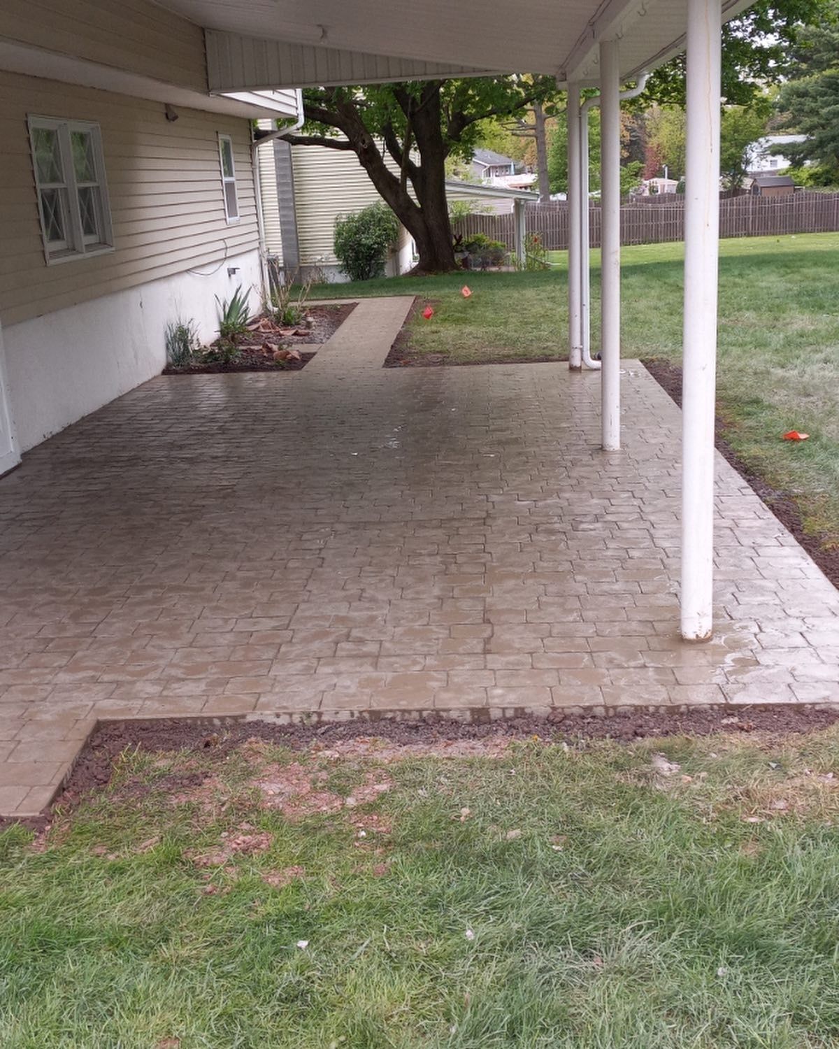 A house with a covered patio in front of it