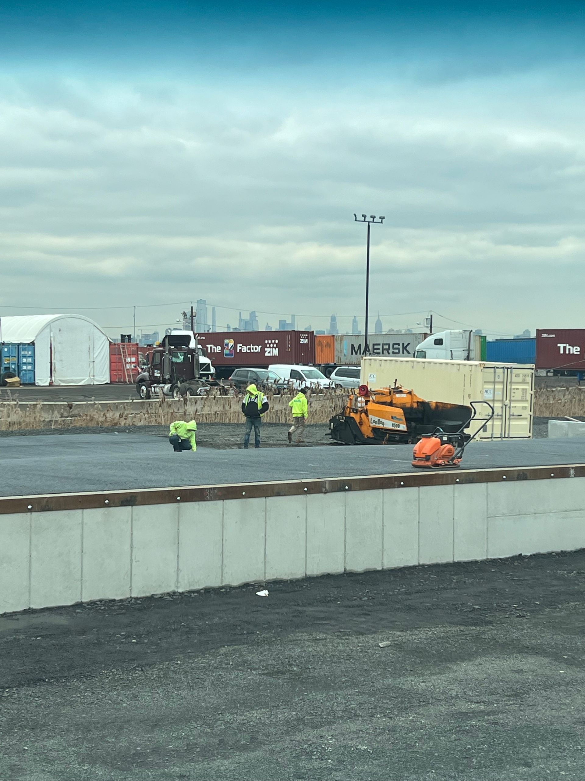 A group of construction workers are working on a construction site