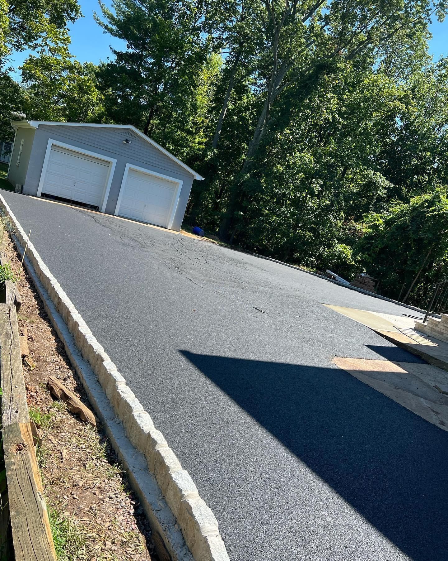 There is a garage on the side of the road.