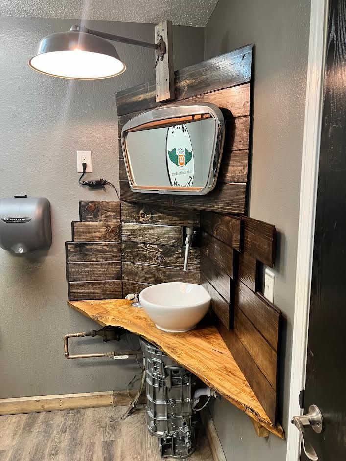 Sink and a mirror on the wall.