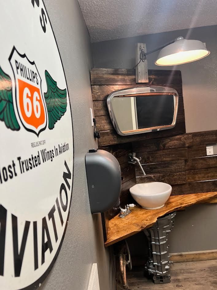 Bathroom with a sign that says aviation on it