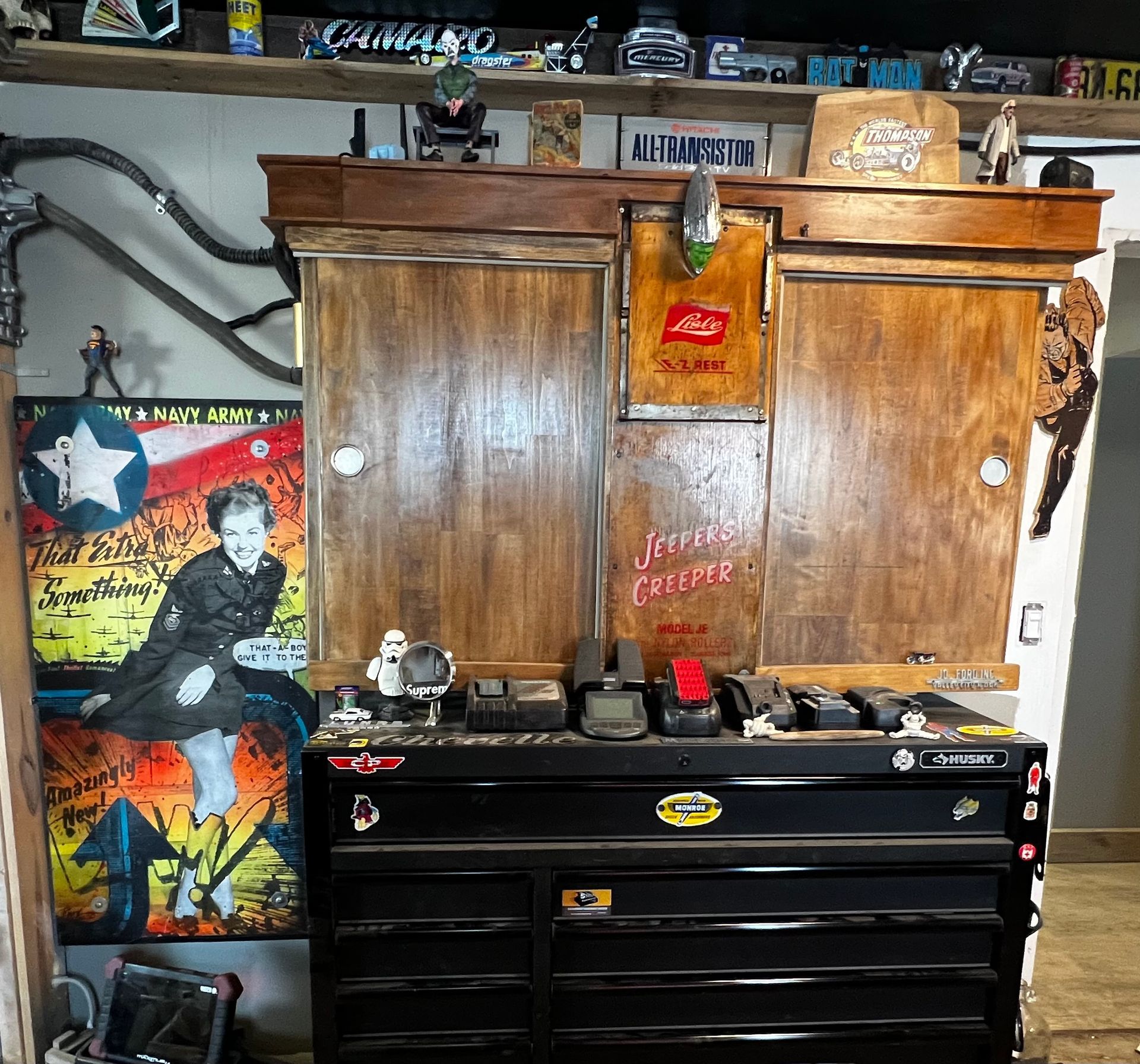 A cabinet with a picture of a man on it and a sign that says 'a little twist' on it.