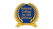National College for DUI Defense blue-and-gold crest with laurel wreath