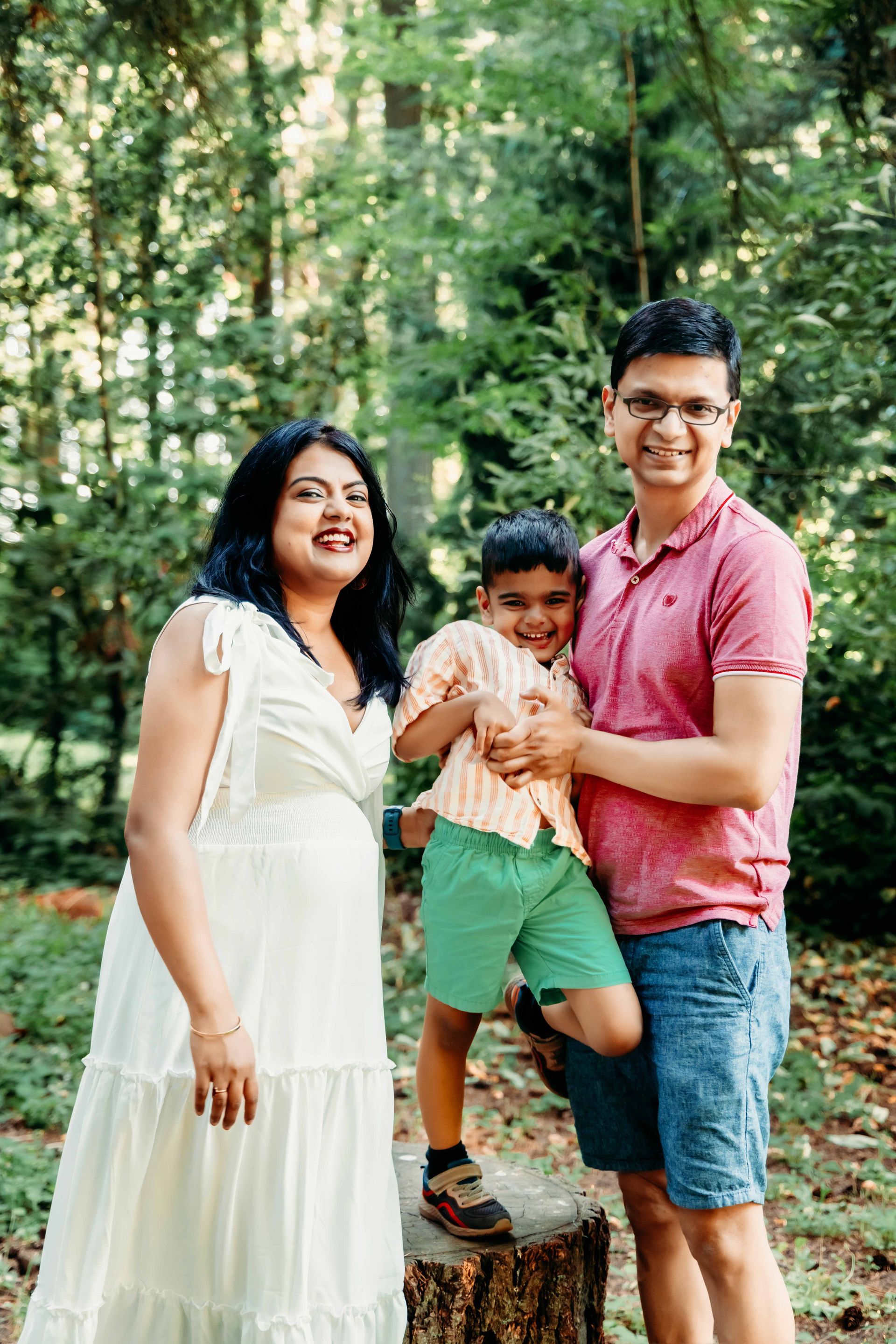 A young girl is holding a yellow flower in her hand.