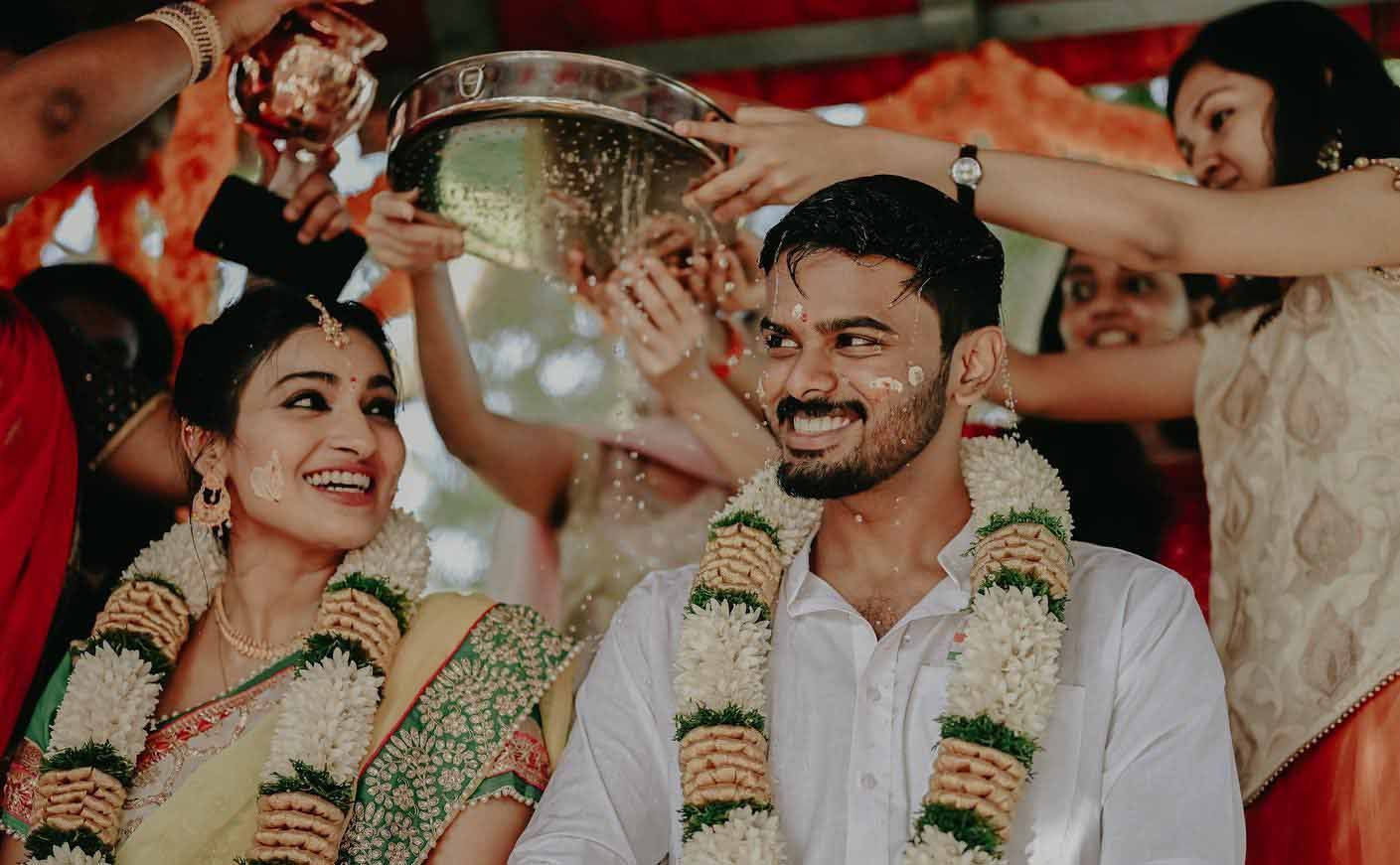 A bride and groom are standing next to each other during a wedding ceremony.