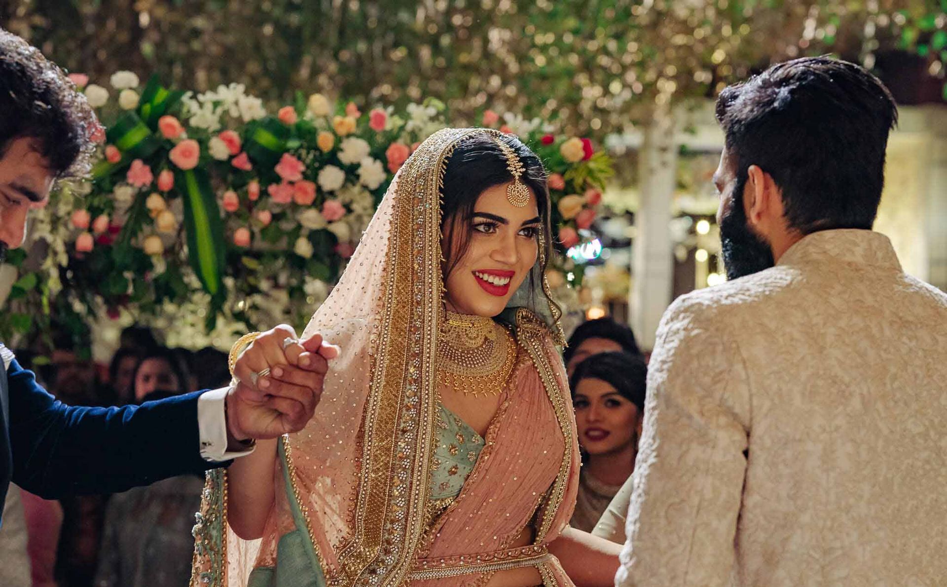 A bride and groom are standing next to each other at a wedding ceremony.