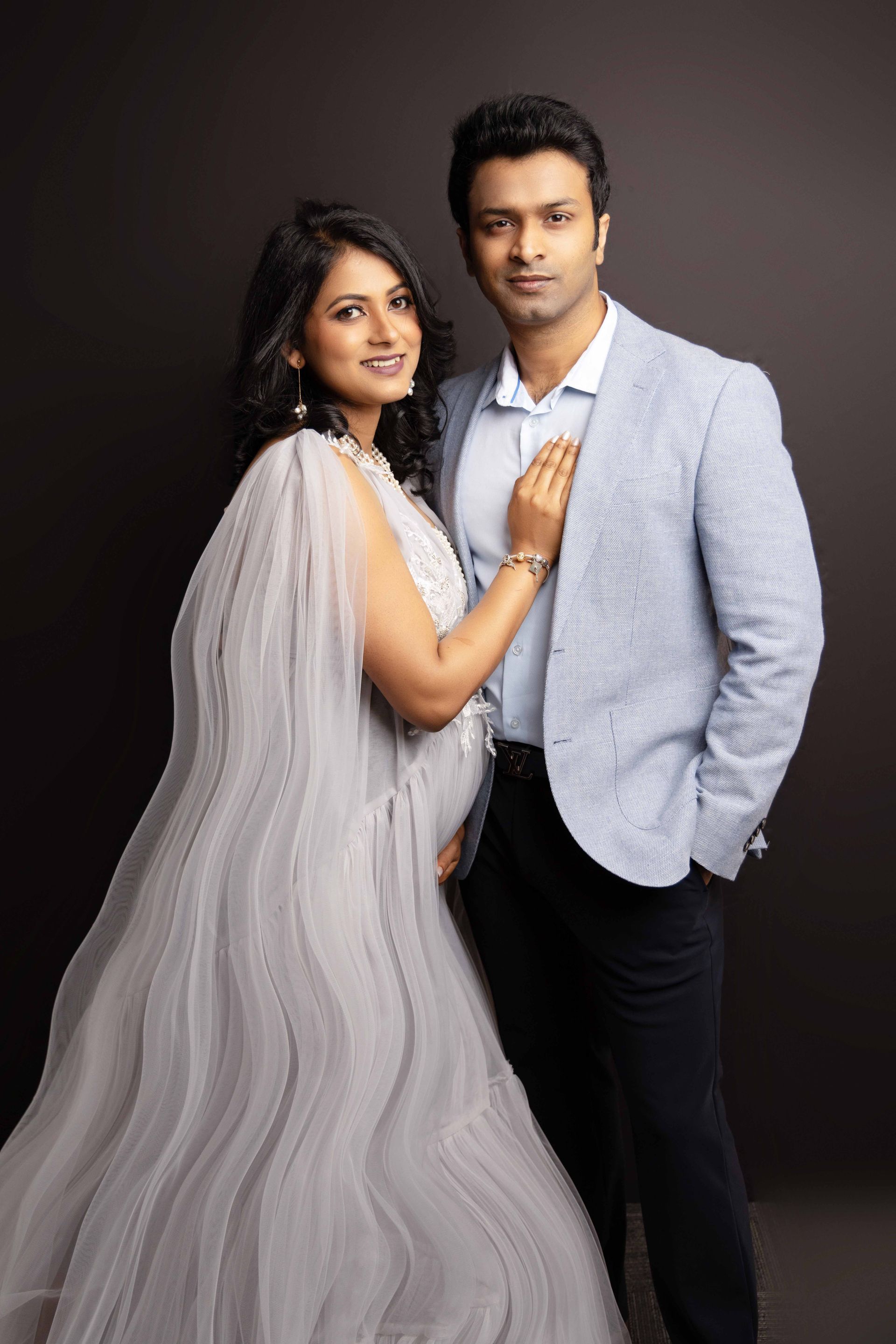 A man and a woman are posing for a picture together.