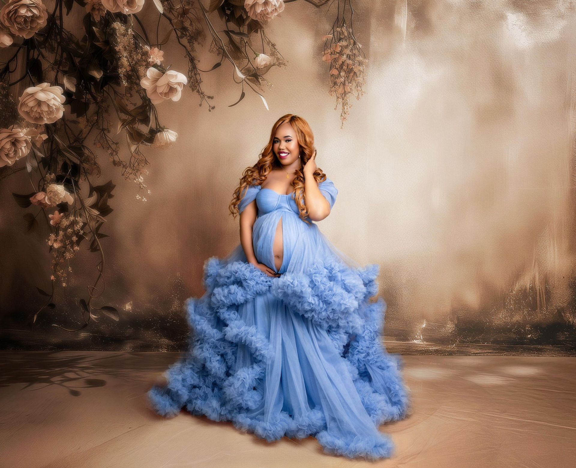 A pregnant woman in a blue dress is standing in front of a wall with flowers.