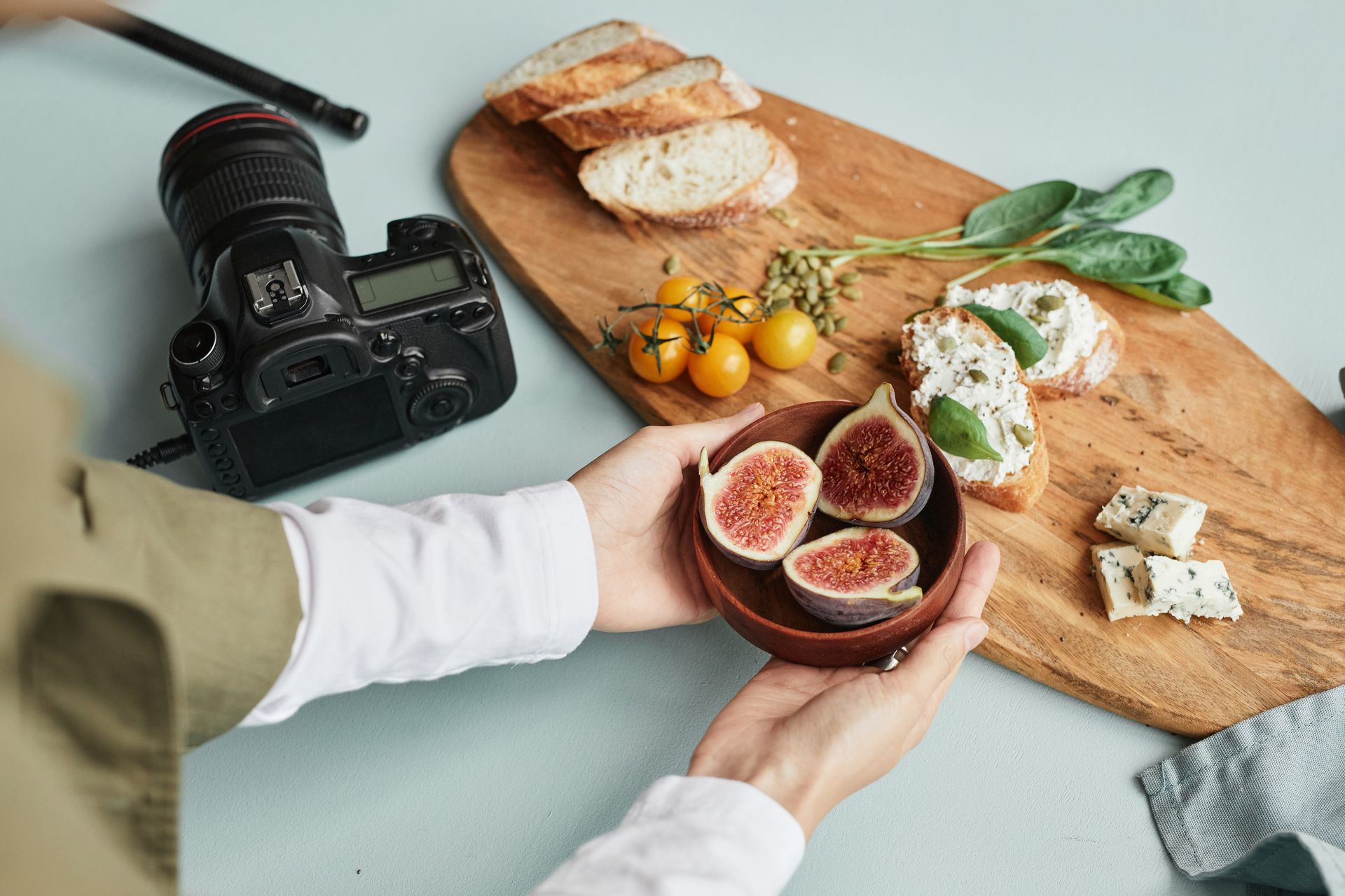 A person is holding a bowl of food in front of a camera.