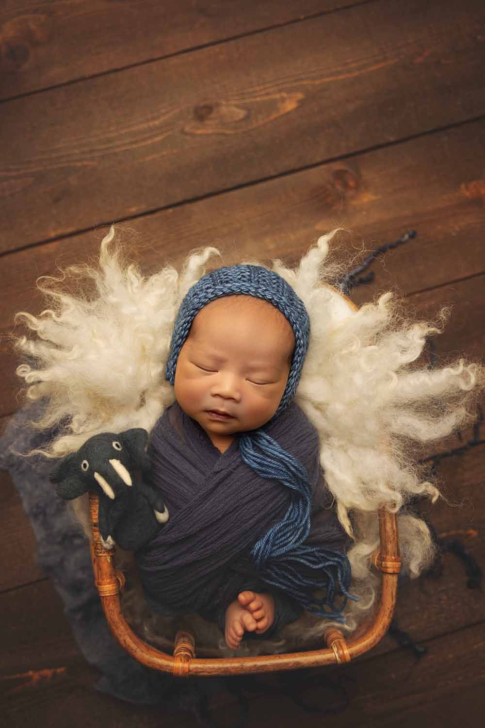 Sleeping newborn baby in a basket