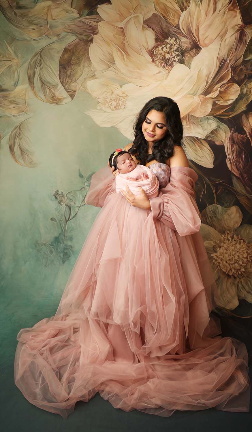 Mother carrying her newborn baby