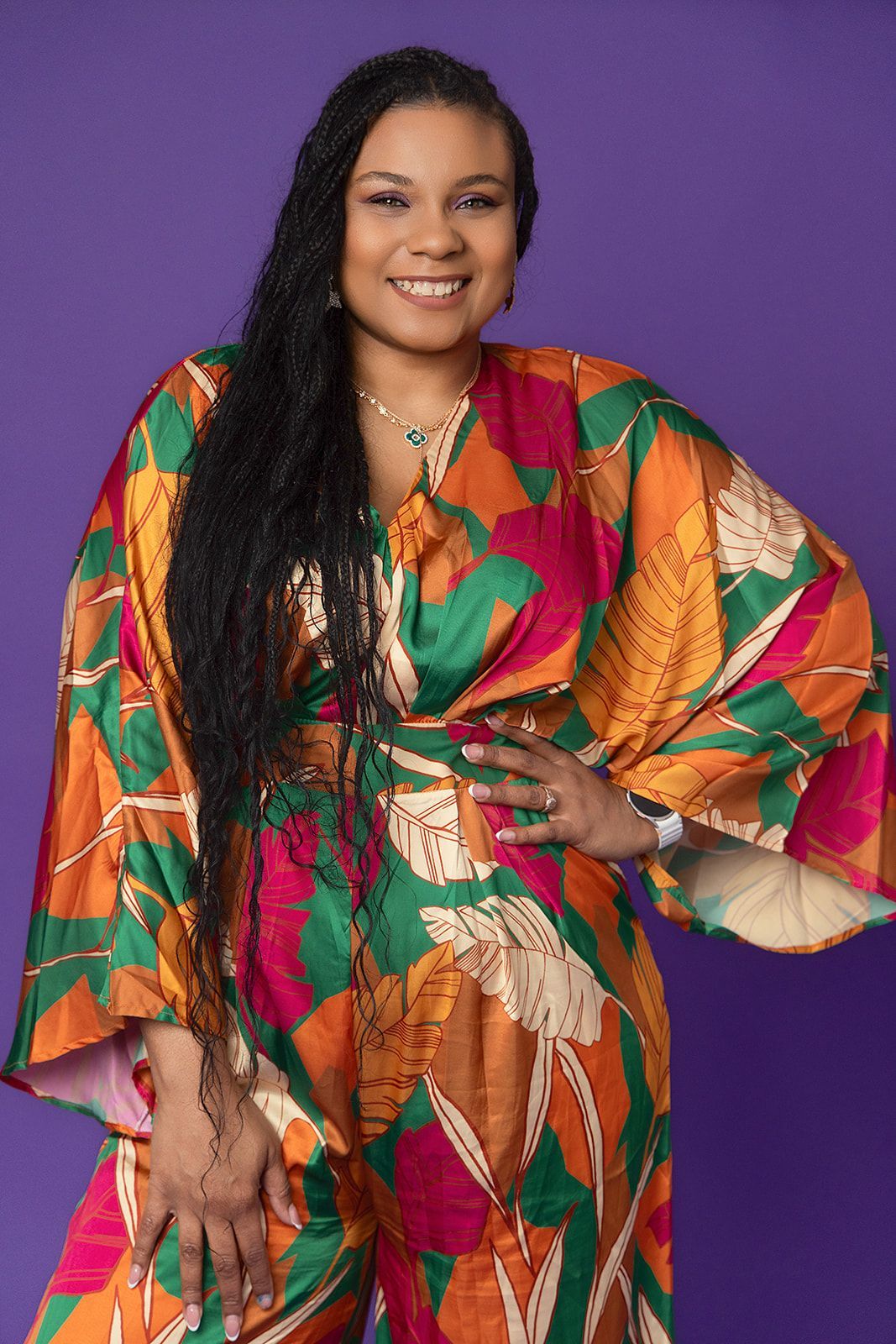 A woman in a colorful jumpsuit