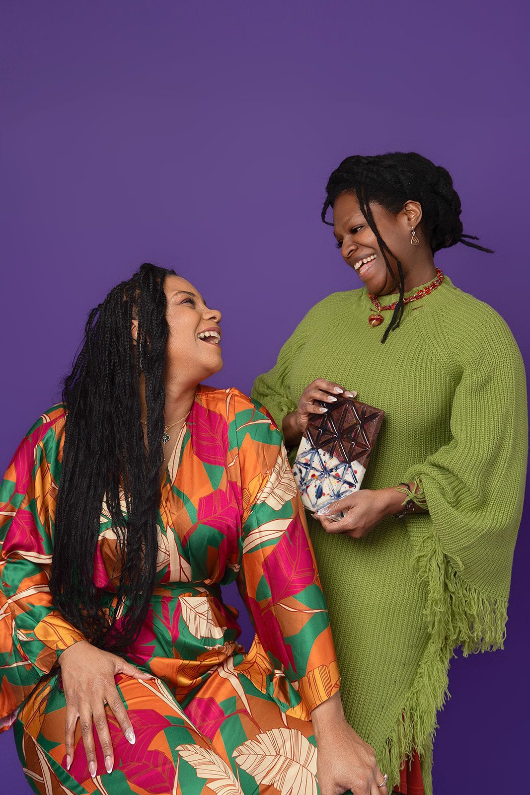 Two women are sitting next to each other