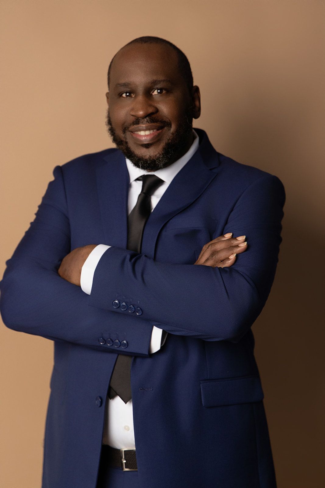 A man in a blue suit and tie