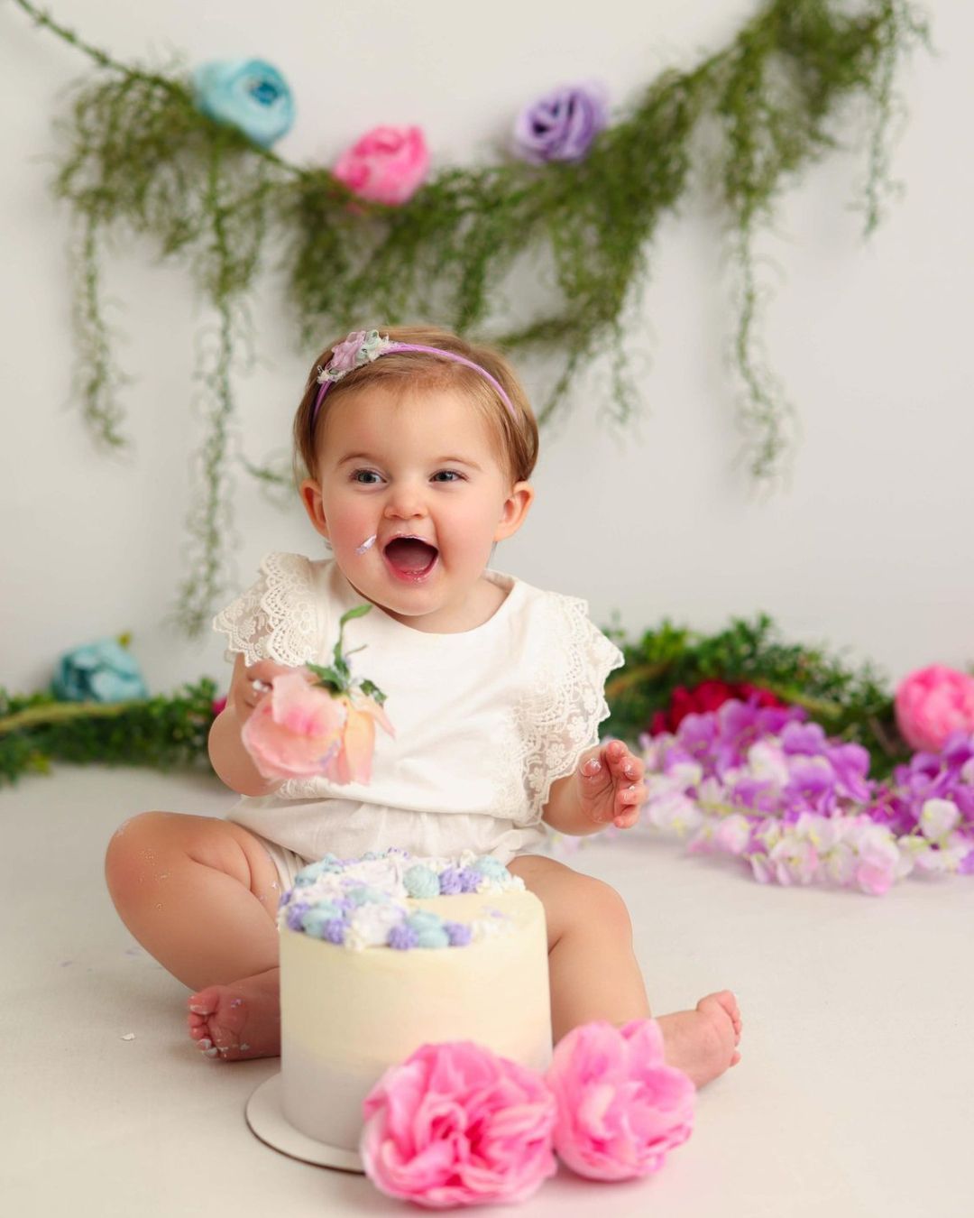 Baby smashing a cake